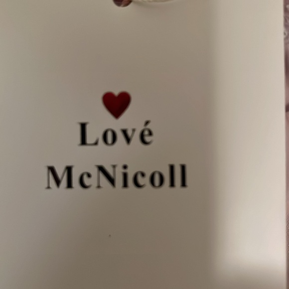 Love McNicoll pretty pastel coloured dress with a peach long camisole underneath - Picture 6 of 7